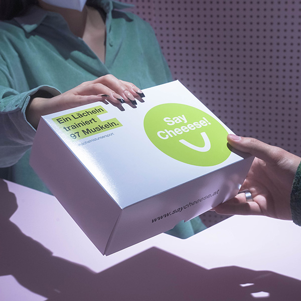 Handing over the SayCheeese box with the aligners